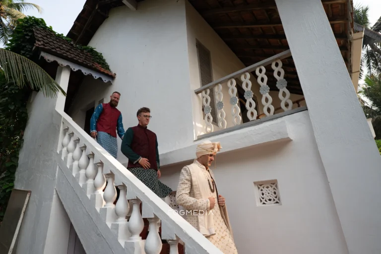 David and his groomsmen on the white staircase at Prainha Resort before the ceremony