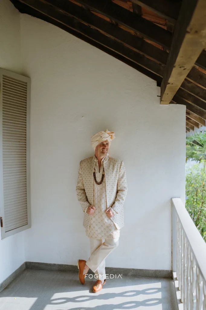 David waiting on the balcony in his wedding sherwani at Prainha Resort, Dona Paula