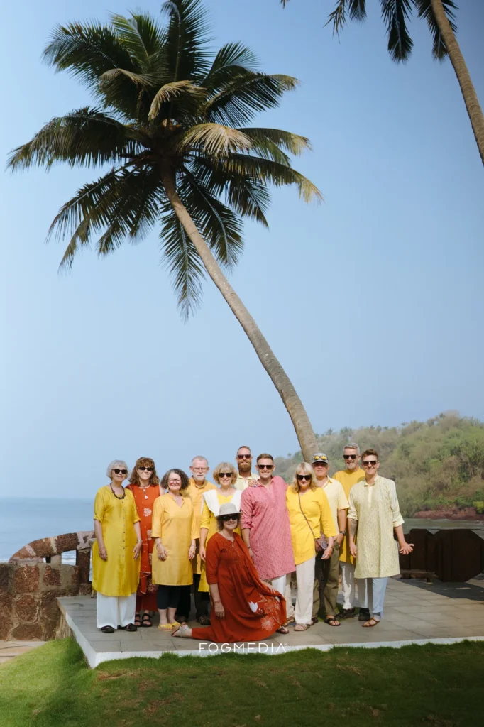 Guests in yellow gathered for a group portrait at the haldi, Prainha Resort by the Sea, Goa