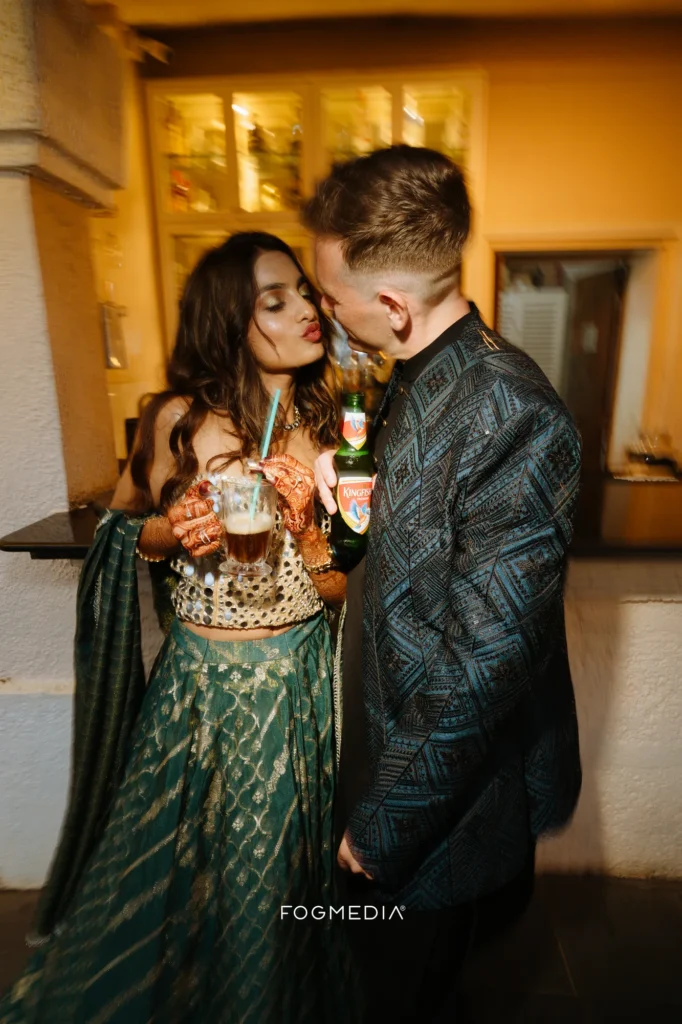 Salonee and David with drinks in hand during the Sangeet at Prainha Resort
