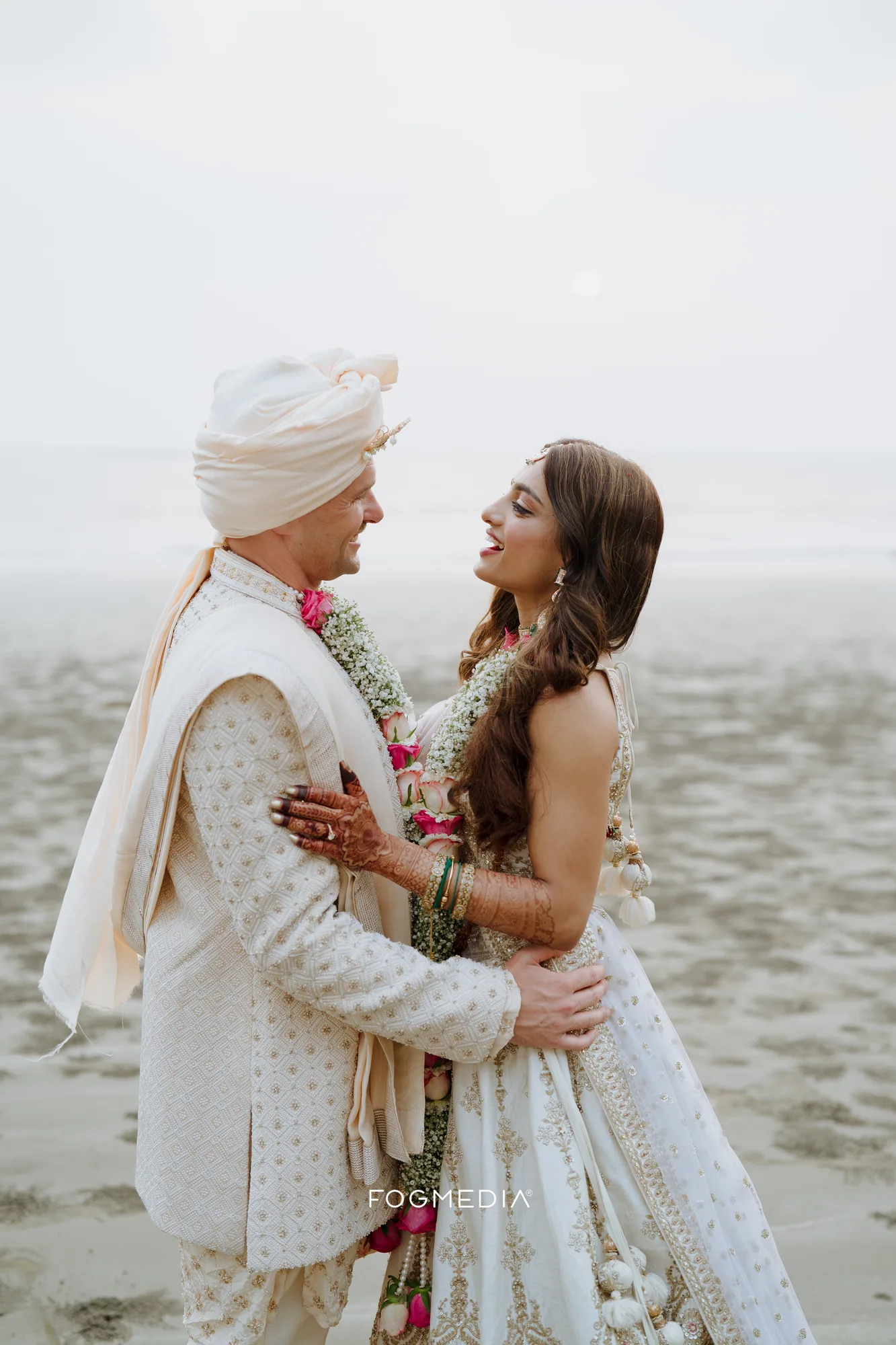 Salonee and David on the beach at Prainha still wearing the gypsophila and rose varmalas